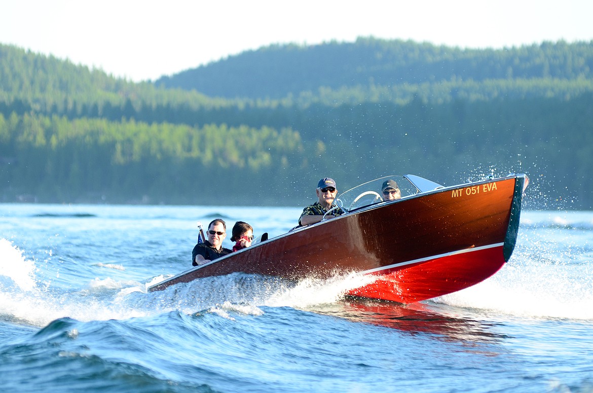 A wooden boat glides across Whitefish Lake during the Whitefish Woody Weekend in 2013. (Whitefish Pilot FILE)