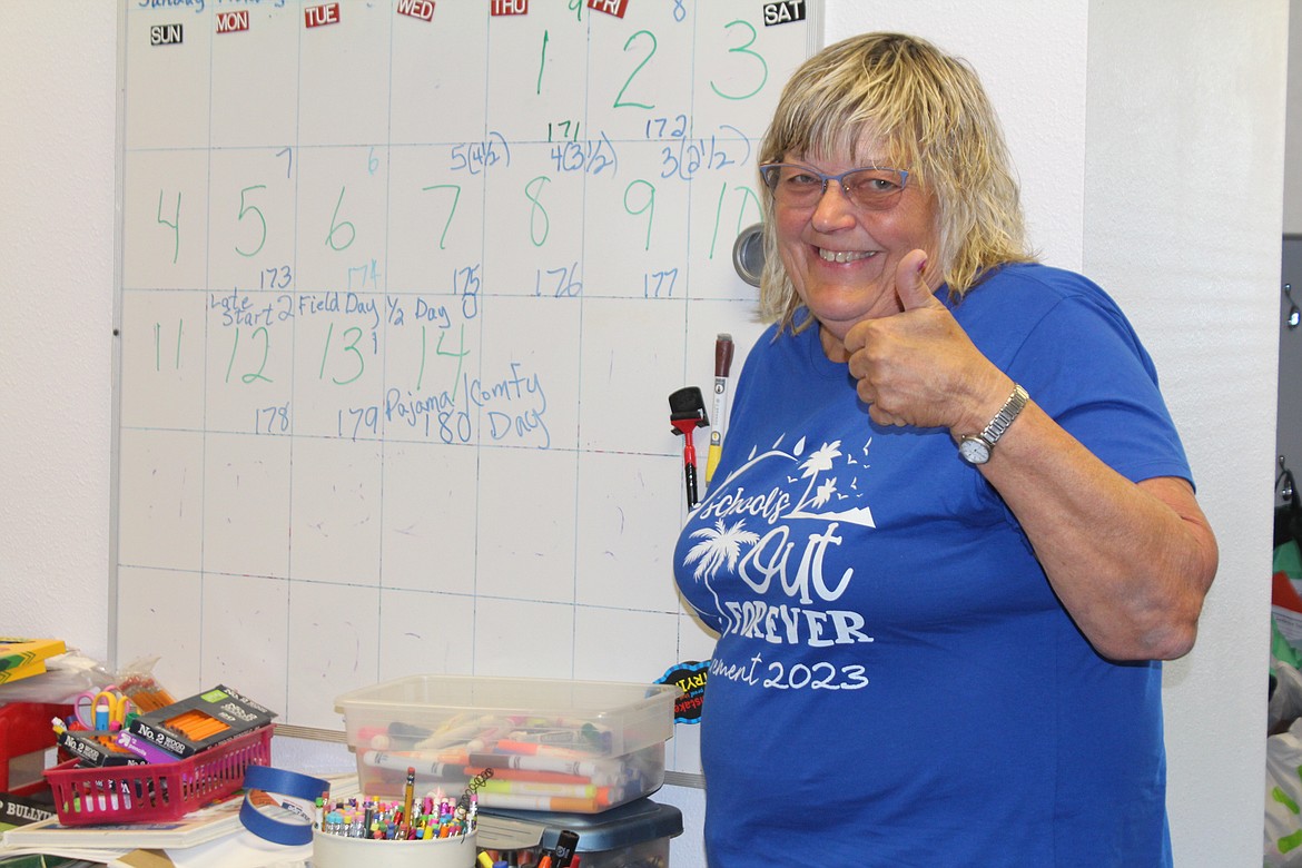 Joan Dopps gives a thumbs-up on the last day of school ever - for her - after a 43-year teaching career.