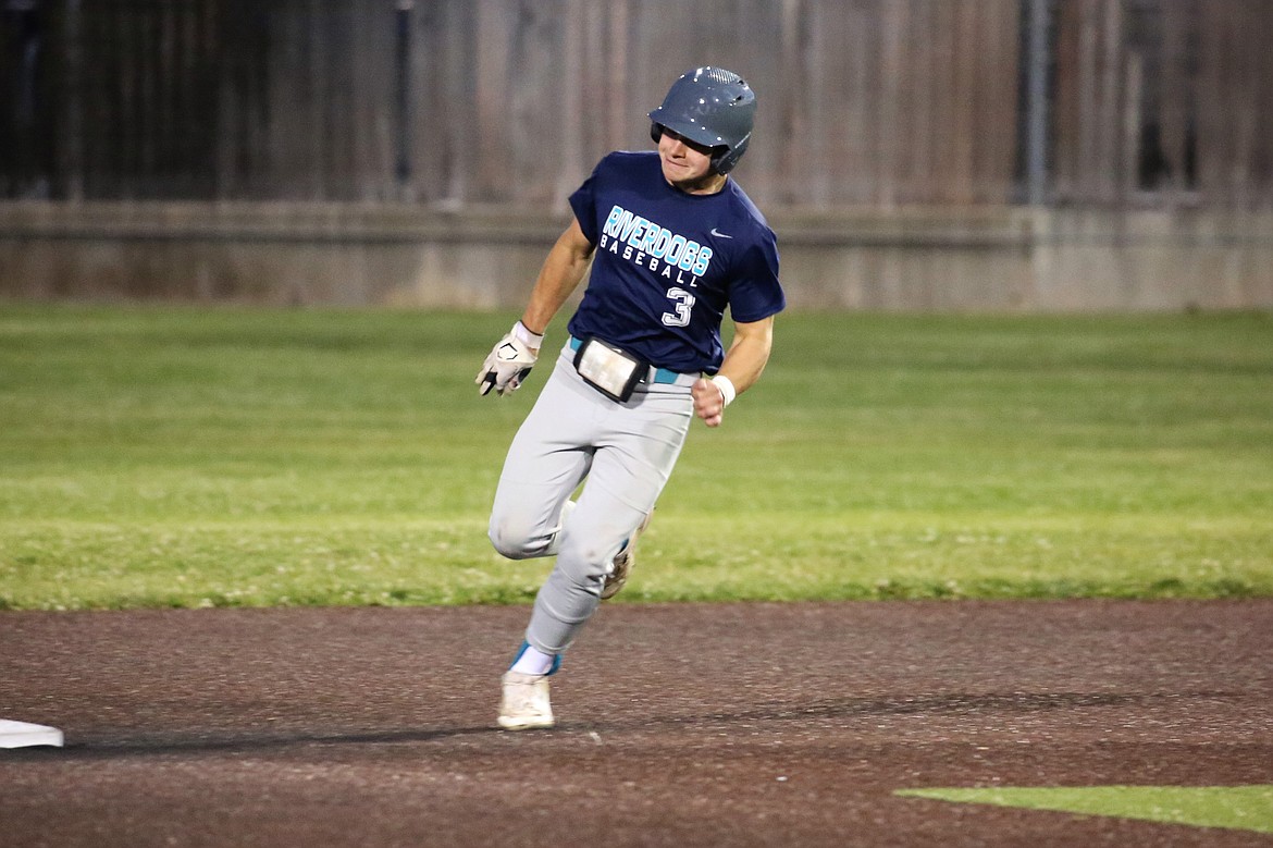 River Dog second baseman Zane Harden rounds a base during a game against Columbia River on Wednesday.