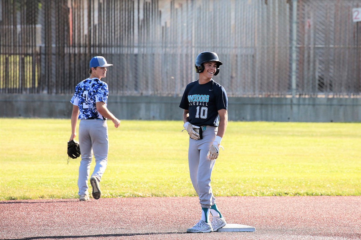 River Dog shortstop Jayce Stuart smiles on base during a game against Columbia River on Wednesday.