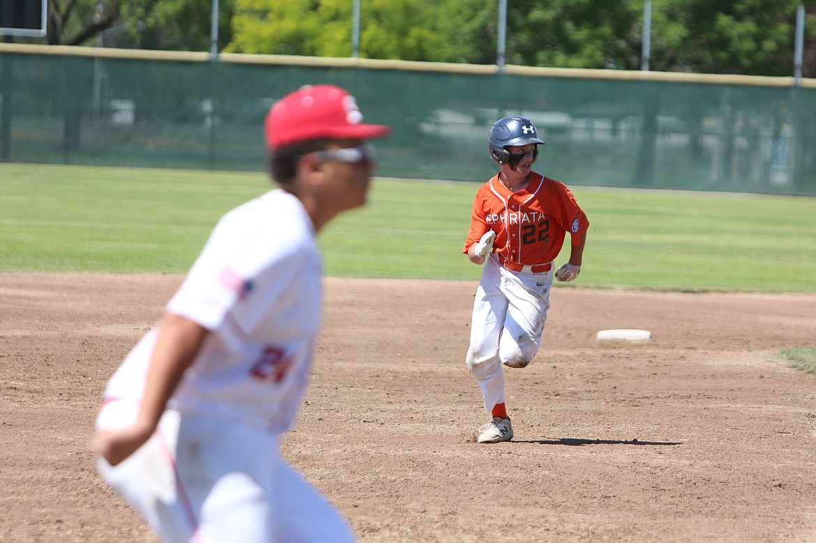 A 14U Ephrata baserunner runs toward third base against the Tri-Cities Spartans at the Pete Doumit Memorial Tournament on Sunday.