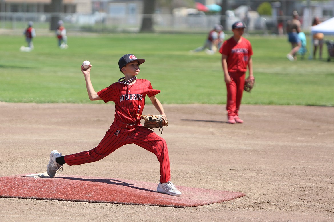 A pitcher for the 11U O-Town Bombers throws a pitch against Lake Stevens at the Pete Doumit Memorial Tournament on Sunday.