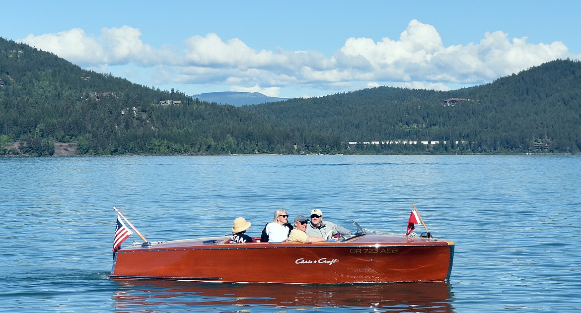 A wooden boat takes a cruise on Whitefish Lake in this file photo.