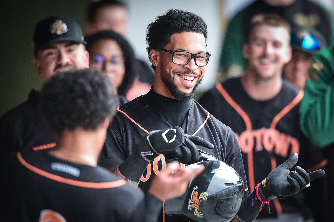 Missoula's Jared Akins (8) celebrates in the dugout after a home run in the seventh inning against the Glacier Range Riders at Glacier Bank Park on Friday, June 16. (Casey Kreider/Daily Inter Lake)