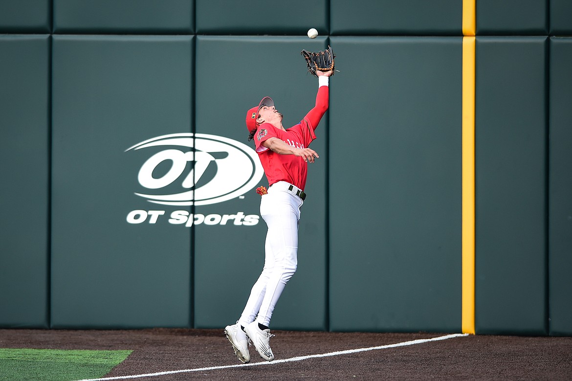 Glacier right fielder Mason Dinesen (23) makes a catch at the wall in the second inning against the Missoula Paddleheads at Glacier Bank Park on Friday, June 16. (Casey Kreider/Daily Inter Lake)