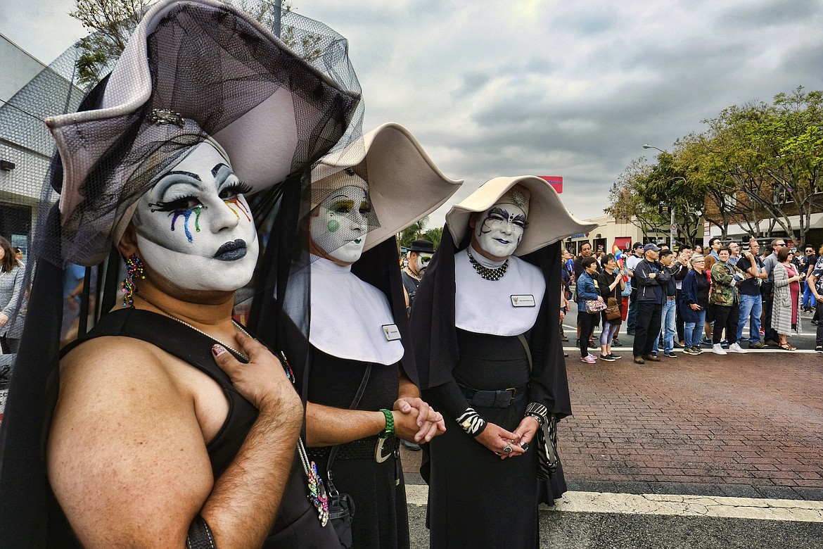 Members of the Sisters of Perpetual Indulgence attend a gay Pride parade in West Hollywood, Calif., on Sunday, June 12, 2016. Three prominent Catholic leaders — including the archbishops of New York and Los Angeles — said the Los Angeles Dodgers should have stuck by its short-lived decision to exclude the satirical LBGTQ+ group from the 2023 Pride Night because it features men dressed flamboyantly as nuns. Under fire from LGBTQ+ activists, the team re-invited the group. (AP Photo/Richard Vogel, File)