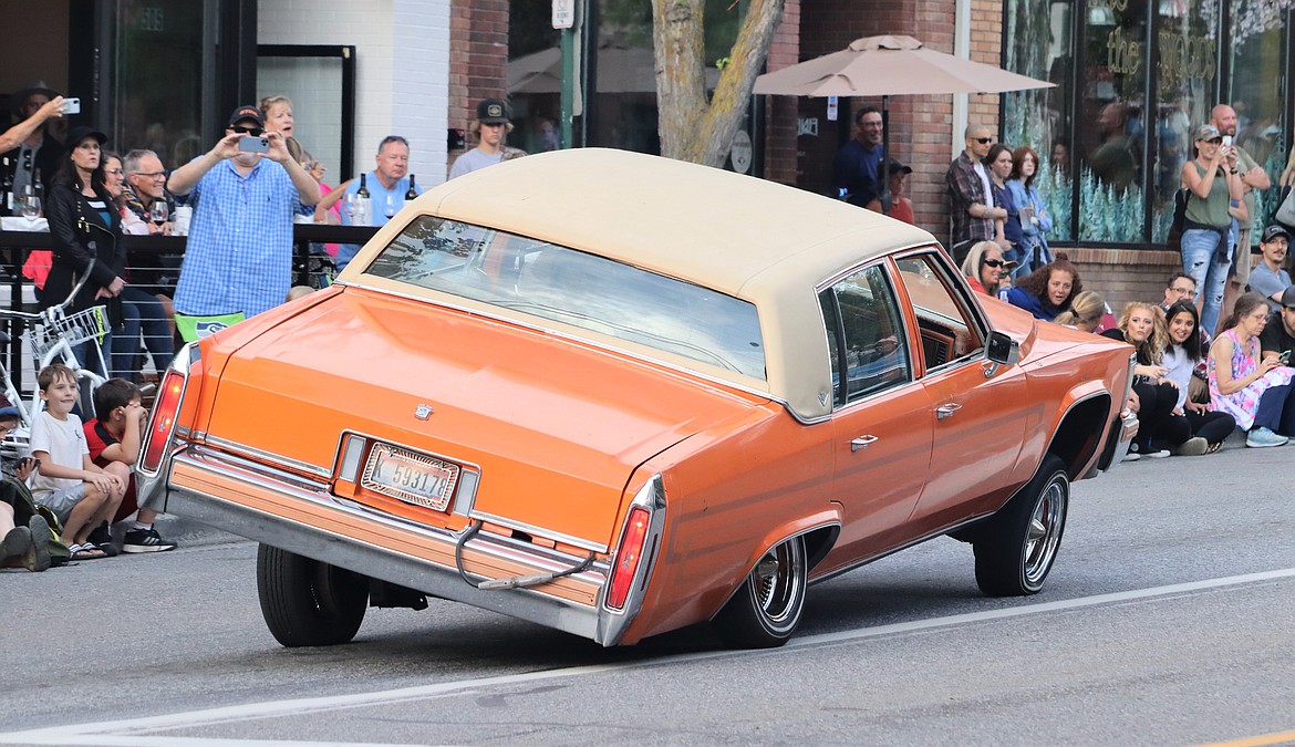 A driver puts on a show for the Car d'Lane crowd Friday.