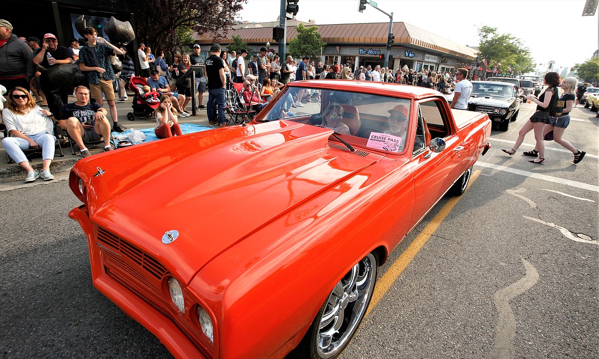 Billy Joe and Jane Arnold of Coeur d’Alene ride on Sherman Avenue in their 1965 El Camino during Car d'Lane's cruise Friday.