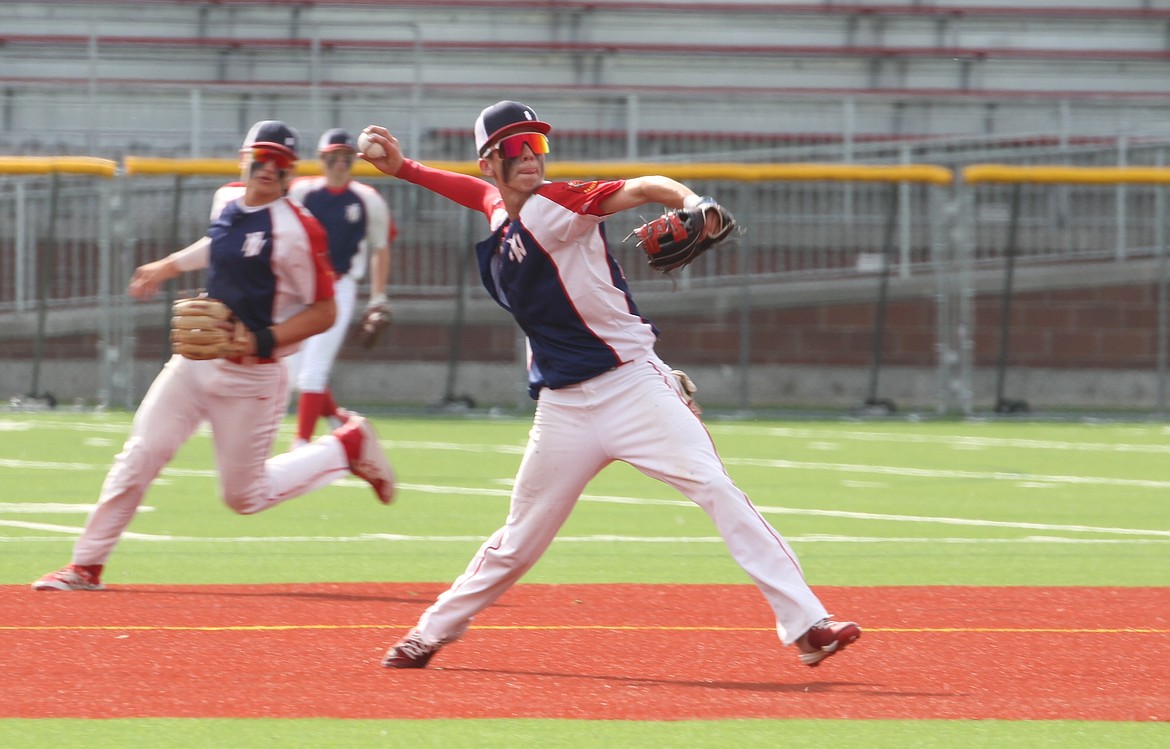 Mason Little makes a play at third base in Game 1.