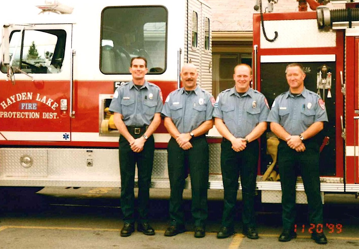 Northern Lakes Division Chief of Training Mike Mather, far right, was one of two who were the last hired by Hayden Lake Fire District before consolidation to form Northern Lakes Fire District. He is seen here in this Nov. 20, 1999, photo. From left, former Northern Lakes firefighter Bill Gunterman, retired Battalion Chief Marc Ghiraduzzi, Battallion Chief Kevin Croffoot and Mather.