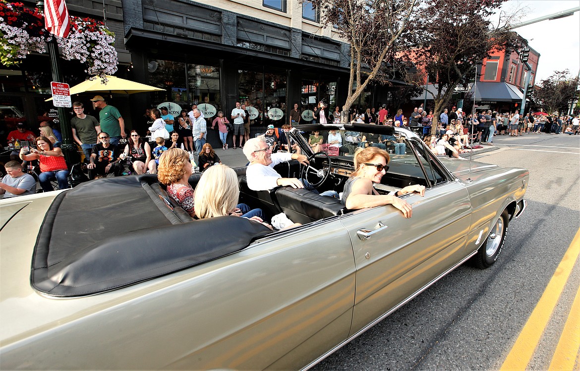 Chris and Cris Wheeler of Bonners Ferry cruise in their 1966 Ford Galaxie 500 convertible, with passengers Debbie Ard and Lesley Ard, in Car d'Lane.