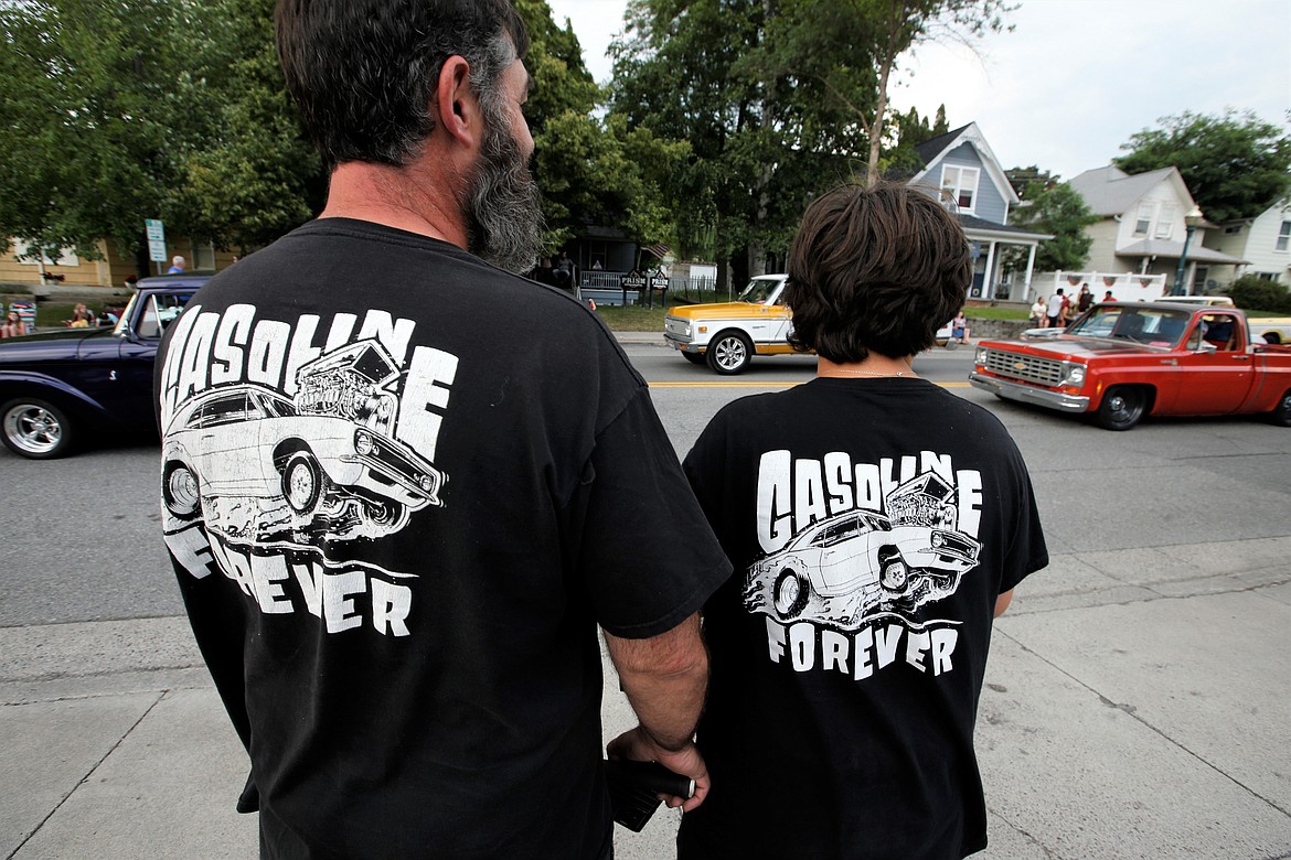 Chris Fuller, left, and Bryce Fuller watch the Car d'Lane cruise on Lakeside Avenue Friday night.