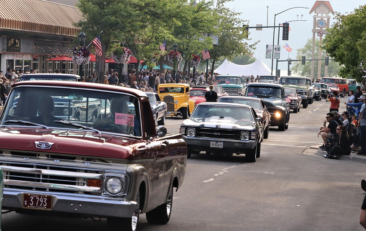 The Car d'Lane cruise flows on Sherman Avenue as a crowd watches Friday night.