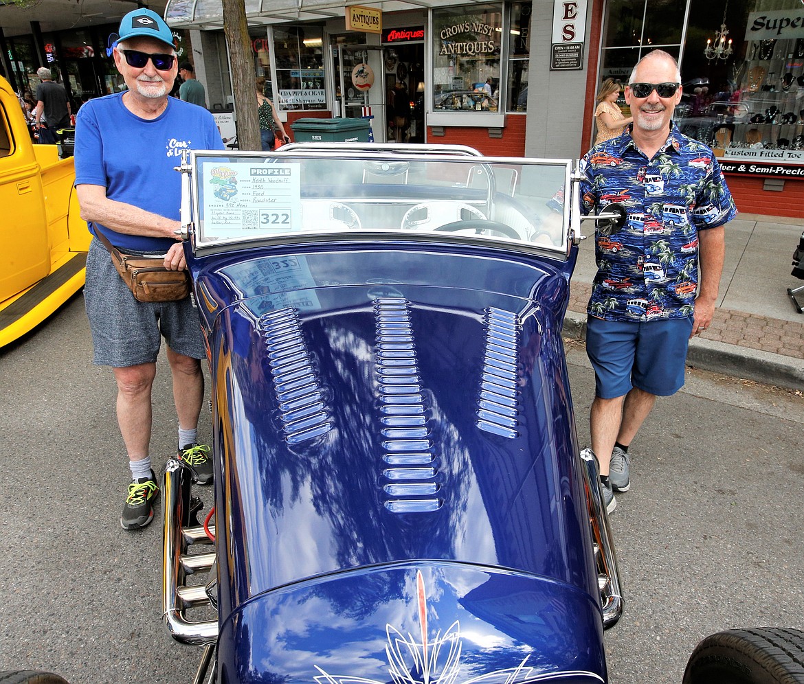 Ken Woodruff, left, and son Keith Woodruff flank Keith's 1930 Ford Roadster at the Car d'Lane show on Saturday in downtown Coeur d'Alene.