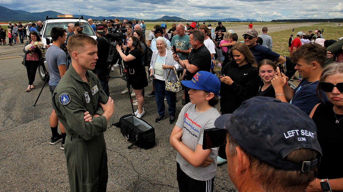 Nate Hale talks with an F-35 pilot at the Coeur d'Alene Airport on Saturday.