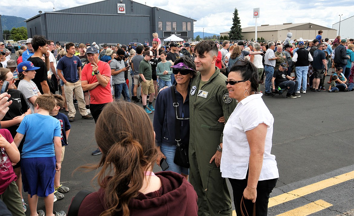 An F-35 pilot whose call sign is "TFuG" poses with fans at the Coeur d'Alene Airport on Saturday.