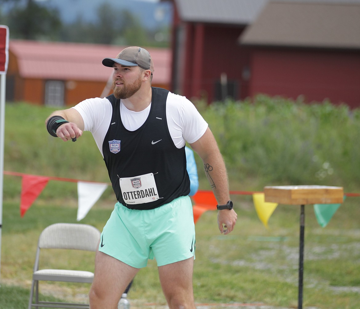 JASON ELLIOTT/Press
Payton Otterdahl, sponsored by Iron Wood Throws Club, reacts after his third throw in the men's shot put lands during the seventh Iron Wood Throws Classic in Rathdrum on Saturday. Otterdahl won the event with a throw of 71 feet, 7 1/2 inches.