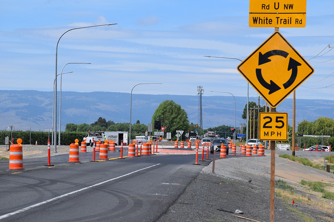 The opening of the new roundabout at White Trail Road and State Route 28 will be delayed until June 26. Above, traffic navigates through the detour set up at that intersection which reduces the roadway to one lane that is managed by a portable traffic light system.