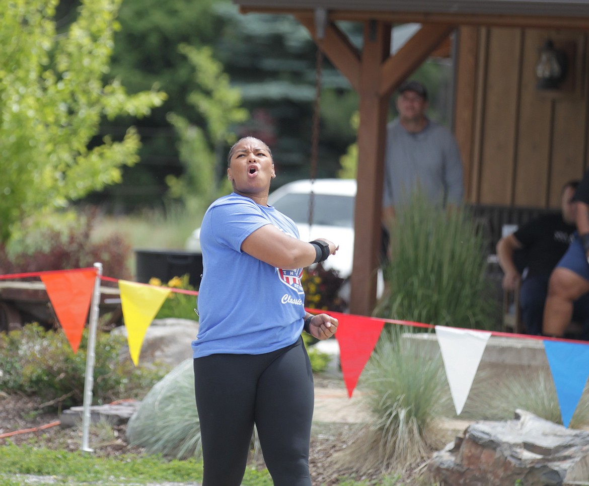 JASON ELLIOTT/Press
Jessica Woodard, sponsored by Iron Wood Throws Club, watches her attempt in the women's shot put during the seventh Iron Wood Throws Classic on Saturday in Rathdrum. Woodard won the event with a throw of 59 feet, 9 1/2 inches.