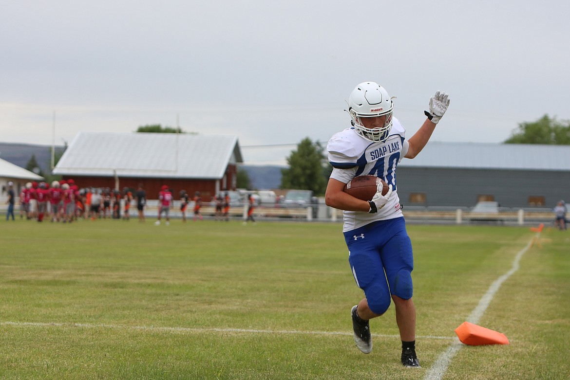 A Soap Lake player runs into the end zone during the goal line portion of Friday’s jamboree.