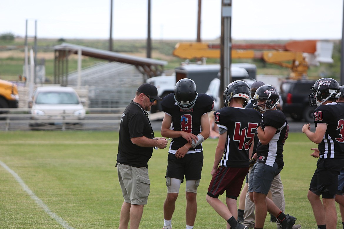 The ACH offense huddles up before a play against Soap Lake.