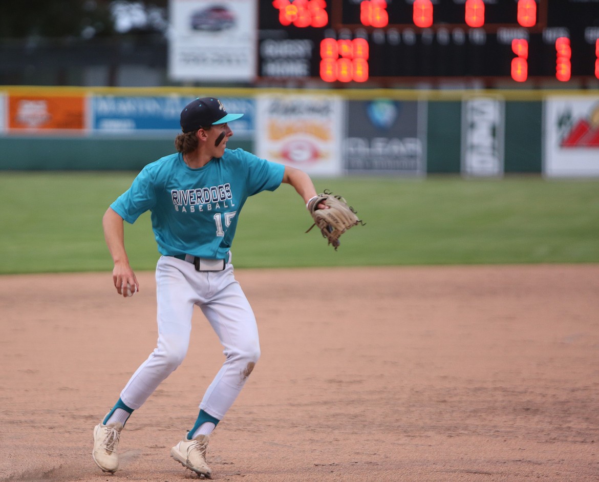 River Dog third baseman Anson Gustafson throws a ground ball to first base for an out.