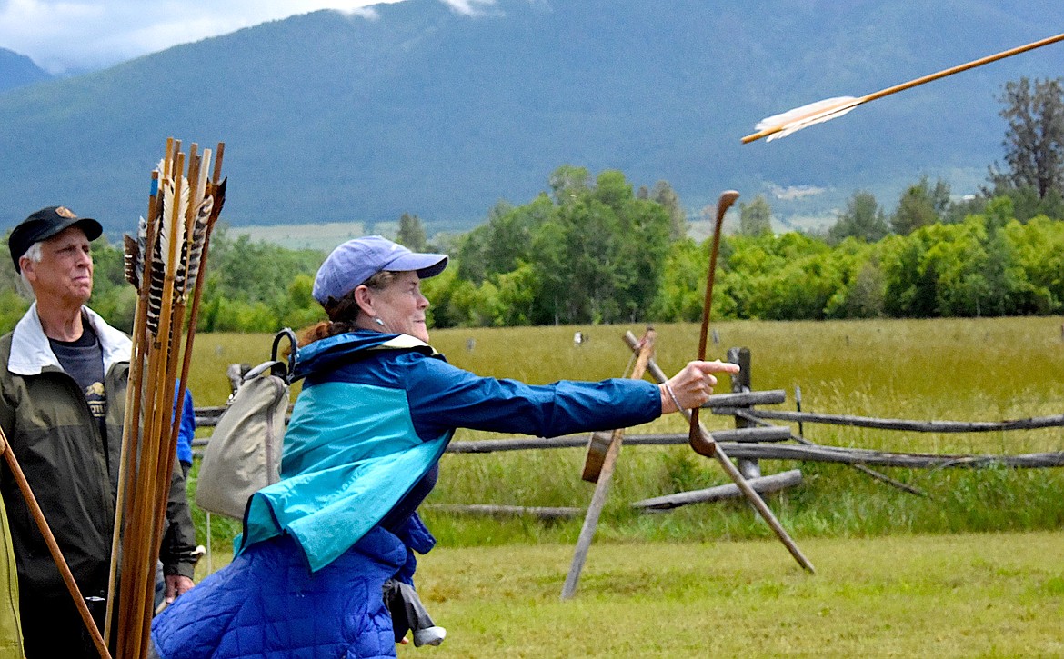 Patricia Kenning, a Connecticut visitor to the Fort Connah Rendezvous, throws a spear using an atlatl. (Berl Tiskus/Leader)