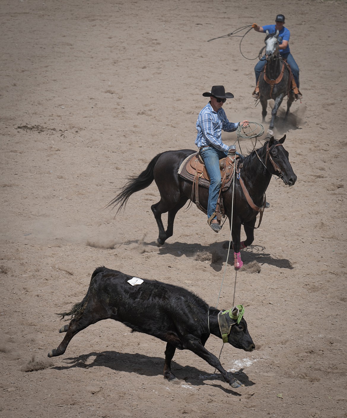 Garrison Ranch with a successful roping at the ranch rodeo. (Tracy Scott/Valley Press)