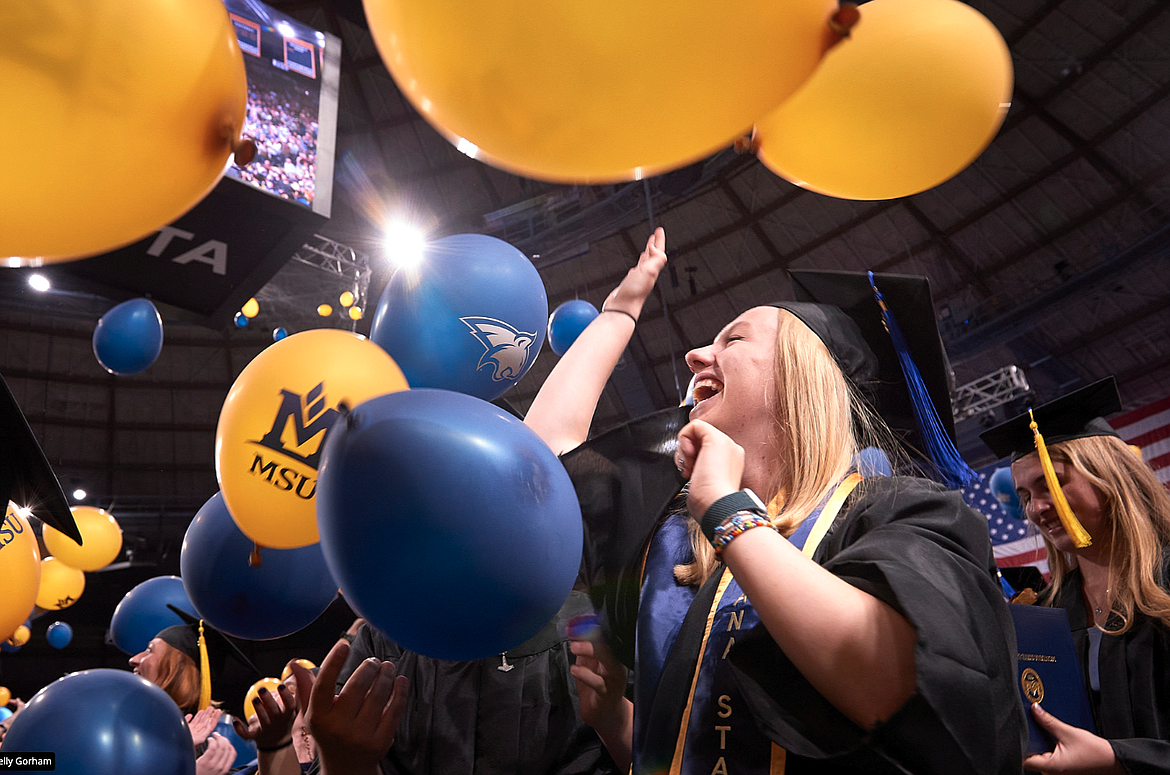 Students celebrate receiving their degrees at the 138th commencement ceremonies May 12 at Montana State University.