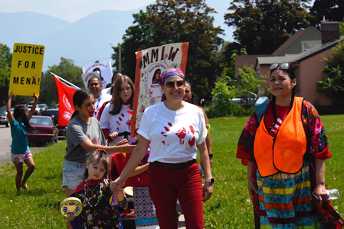 Women, children, and the stroller brigade brought the Mika Matters walk down Fourth to meet the other walkers at the Lake County Courthouse lawn.
(Berl Tiskus/Leader)