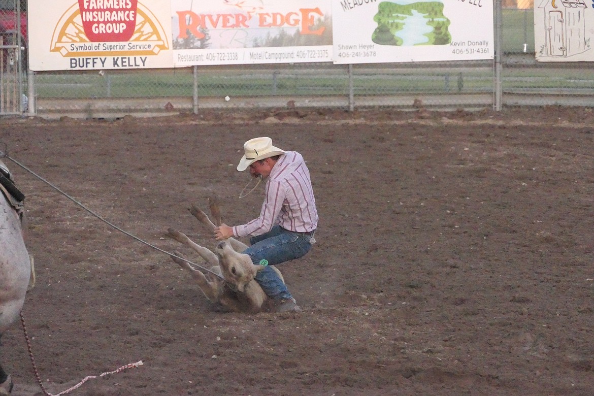 Hot Springs cowboy Jack McAllister ties down a calf after roping it during last year's Superior Rodeo. (Chuck Bandel/VP-MI)