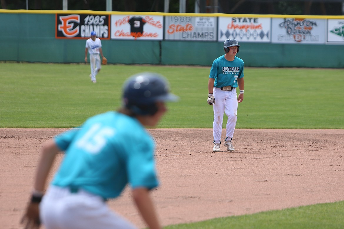 River Dog second baseman Zane Harden (3) leads off from second base while third baseman Anson Gustafson (15) leads off from third base.