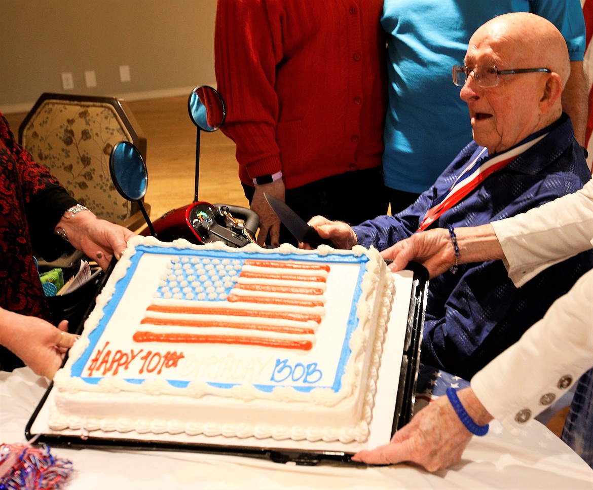 Robert Lawless is presented with a birthday cake on Sunday.