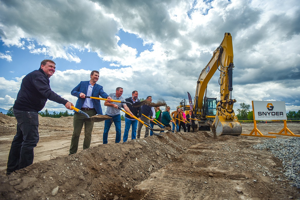 Officials break ground at a ceremony for the Parkline Towers apartment buildings in Kalispell on Tuesday, June 20. (Casey Kreider/Daily Inter Lake)