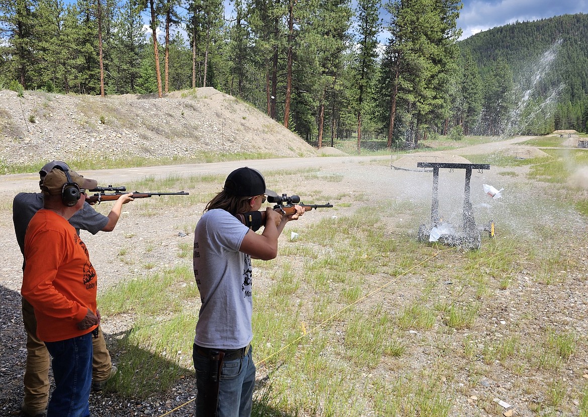 The Stufflebeam brothers from Stevensville fire at the charging water jugs at the Safari Rifle Challenge. (Courtesy photo)