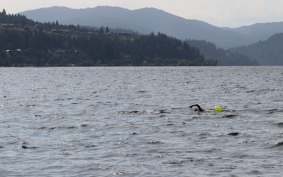 Mitch Ellithorpe heads out for a training swim in Lake Coeur d'Alene at Sanders Beach.