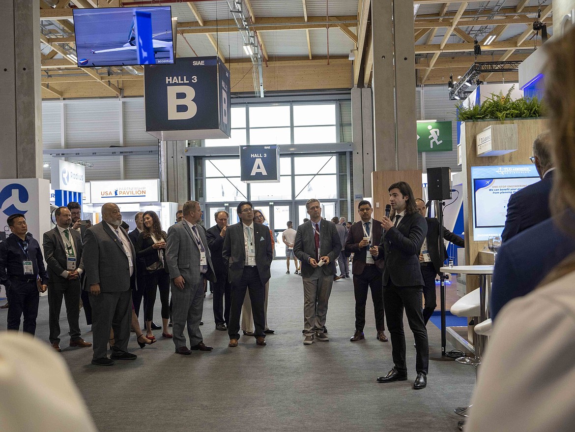 Twelve co-founder and CEO Nicholas Flanders, far right, announces the company’s plans to build a facility to manufacture more sustainable jet fuel in Moses Lake during the Paris Air Show Monday.