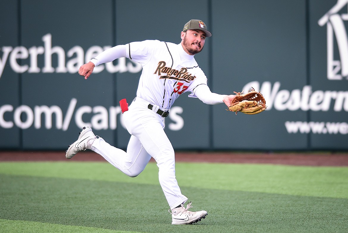 Glacier right fielder Crews Taylor (32) tracks down a fly ball in the first inning against the Great Falls Voyagers at Glacier Bank Park on Wednesday, June 21. (Casey Kreider/Daily Inter Lake)