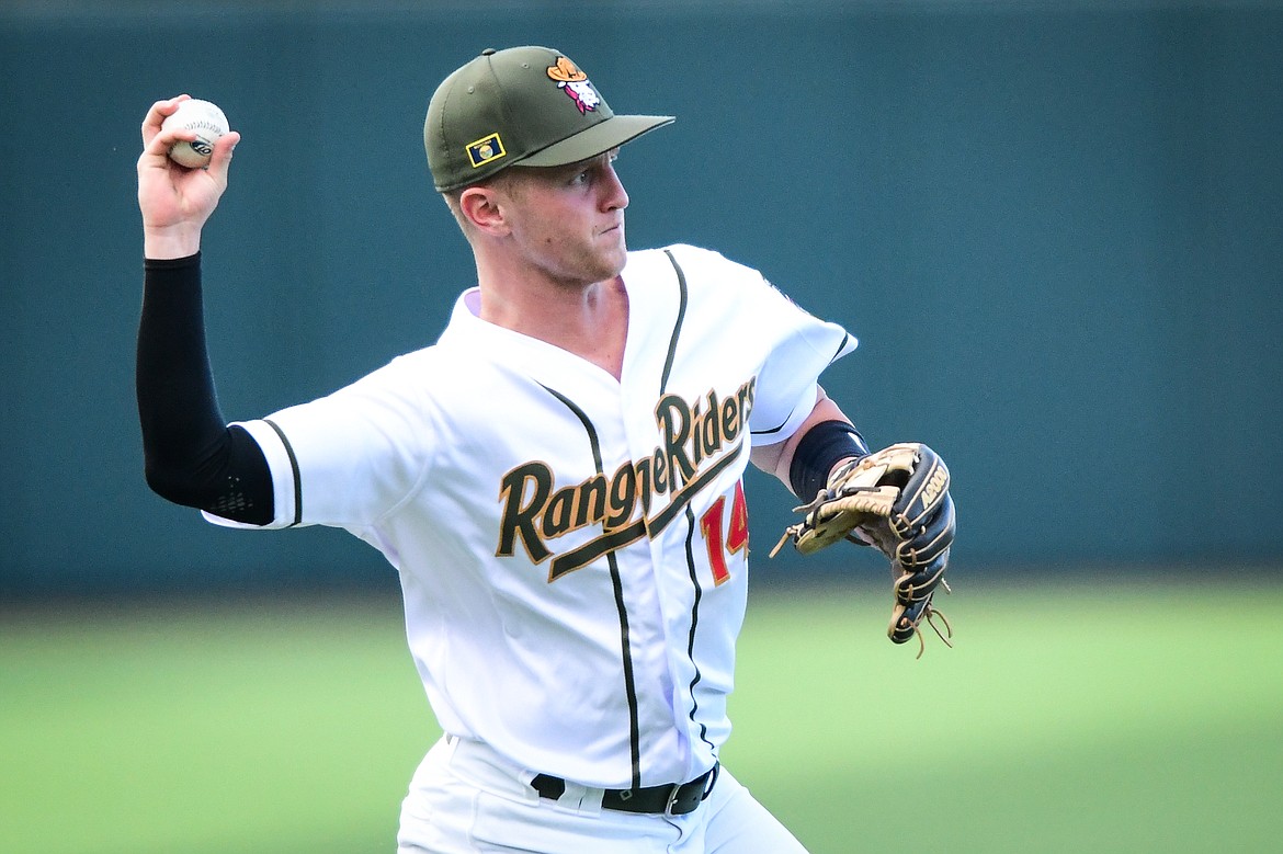 Range Rider third baseman Jackson Raper (14) throws to first after fielding a ground ball in the first inning against the Great Falls Voyagers at Glacier Bank Park on Wednesday, June 21. (Casey Kreider/Daily Inter Lake)