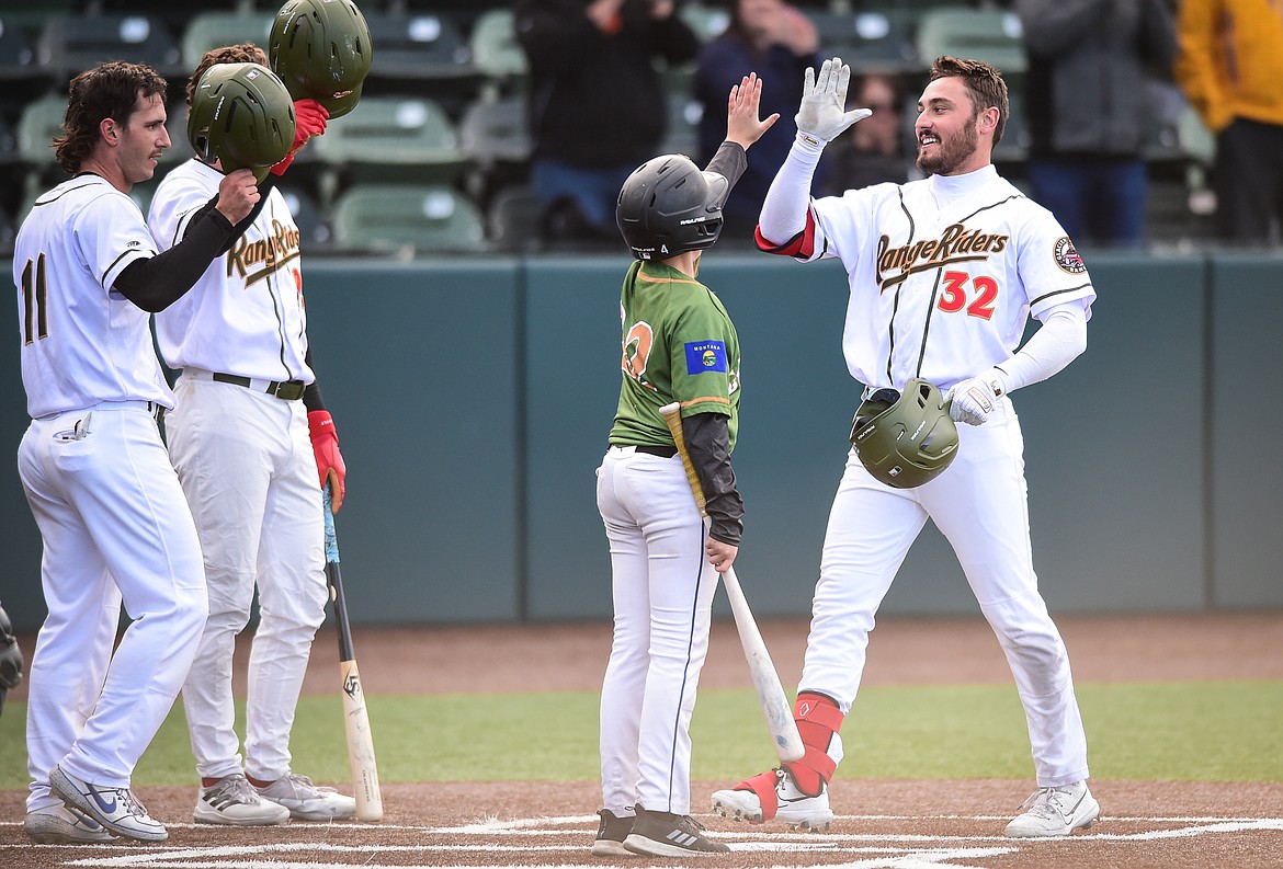 Glacier's Crews Taylor (32) celebrates after a two-run home run in the first inning against the Great Falls Voyagers at Glacier Bank Park on Wednesday, June 21. (Casey Kreider/Daily Inter Lake)