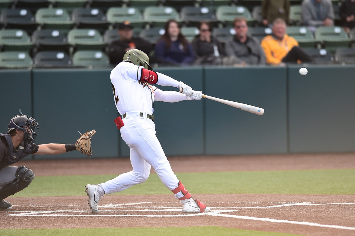 Glacier's Crews Taylor (32) connects on a two-run home run in the first inning against the Great Falls Voyagers at Glacier Bank Park on Wednesday, June 21. (Casey Kreider/Daily Inter Lake)