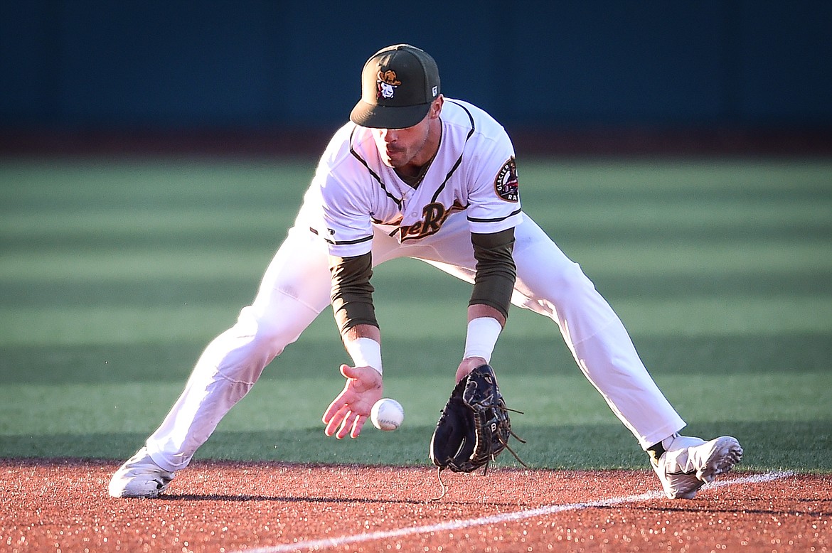 Glacier shortstop Gabe Howell (10) watches a ground ball into his glove hit by Great Falls' Dilan Espinal in the sixth inning at Glacier Bank Park on Wednesday, June 21. (Casey Kreider/Daily Inter Lake)