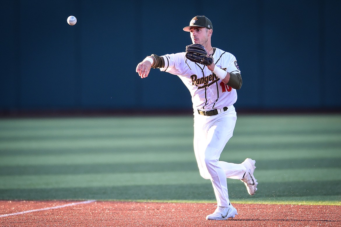 Glacier shortstop Gabe Howell (10) throws to first after fielding a ground ball hit by Great Falls' Dilan Espinal in the sixth inning at Glacier Bank Park on Wednesday, June 21. (Casey Kreider/Daily Inter Lake)