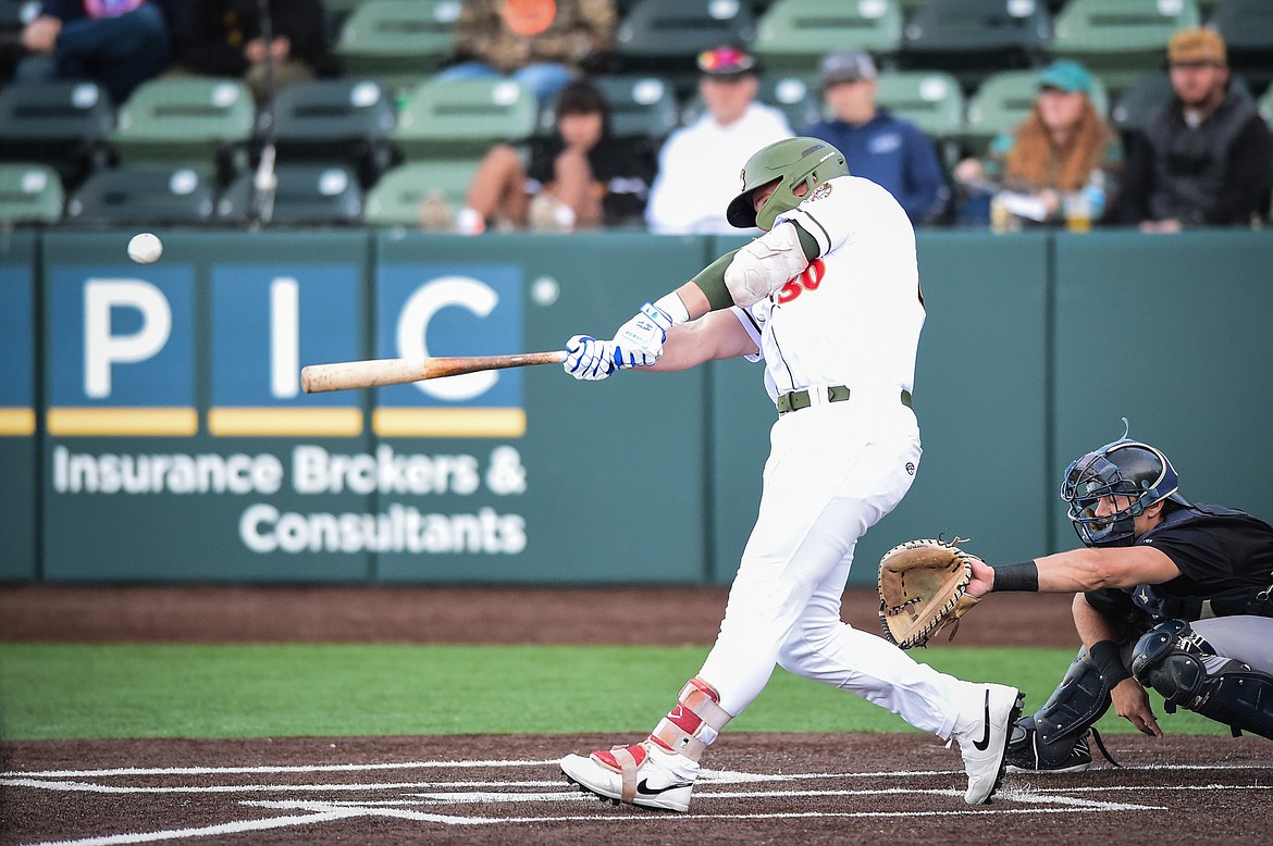 Glacier's Dean Miller (30) connects on a double in the third inning against the Great Falls Voyagers at Glacier Bank Park on Wednesday, June 21. (Casey Kreider/Daily Inter Lake)