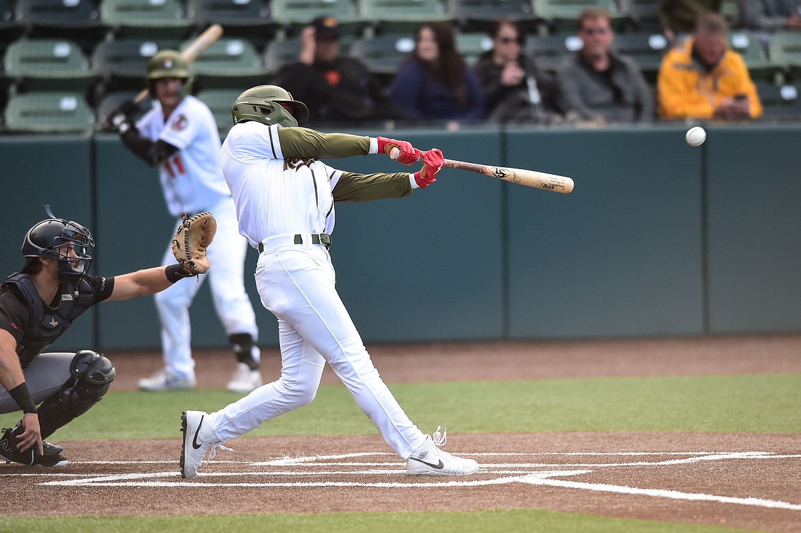 Glacier's Ben Fitzgerald (6) connects on a single in the first inning against the Great Falls Voyagers at Glacier Bank Park on Wednesday, June 21. (Casey Kreider/Daily Inter Lake)