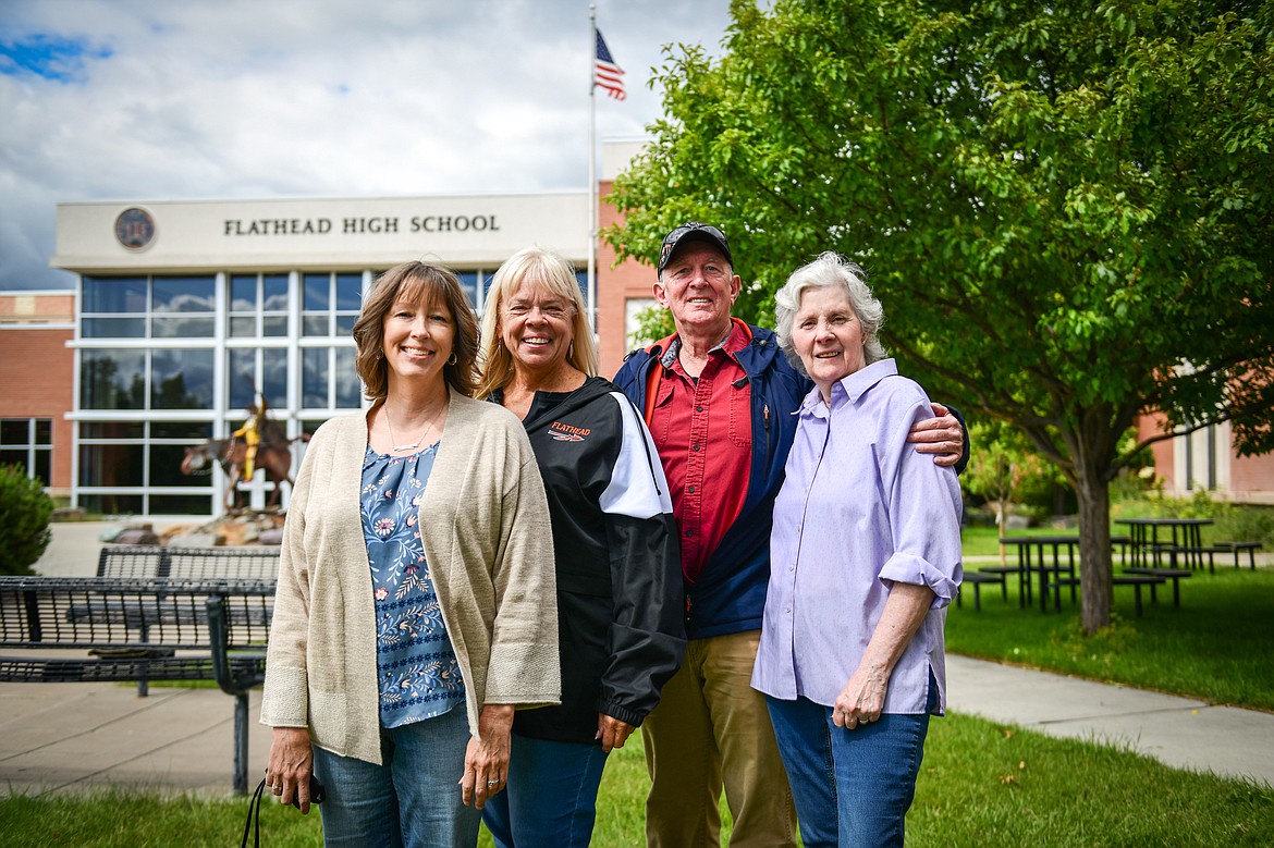 From left, Flathead High School Principal Michele Paine and Class of 1973 alumni Jane Nelson, Scott Foster and Debbie Standley stand in front of an ornamental crabapple tree, right, in front of the high school on Wednesday, June 21. The tree will be dedicated in memory of FHS students who have passed away as part of the class's upcoming 50th reunion. (Casey Kreider/Daily Inter Lake)