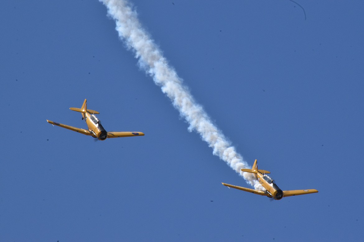 A shot of the Yellow Thunder aerobatics team from Canada in action. Many aircraft used simulated smoke as part of the show.