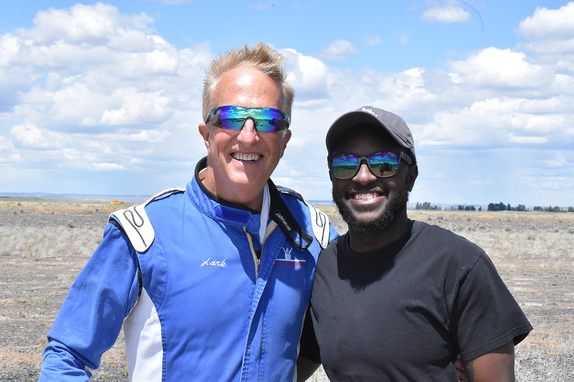 Tom Larkin, left, stops for a photo with local resident Dom Xerxes, right, at the Moses Lake Airshow. Larkin operates a JSF minijet and is a regular at the airshow.