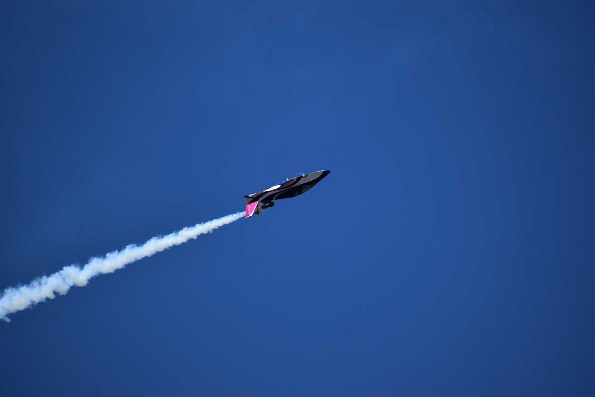 Tom Larkin flies his minijet in an inverted manner over the crowd on Sunday.
