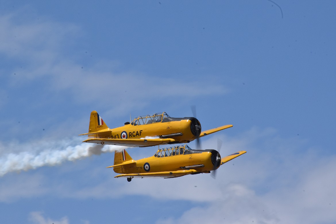 The Yellow Thunder Formation Aerobatic Team’s Harvard aircraft – piloted by Canadian brothers David Watson and Drew Watson, fly a series of maneuvers over the airshow grounds on Sunday. More information on the brothers and their aircraft can be found at yellowthunder.ca.